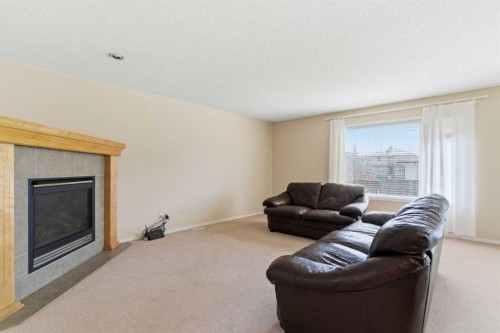 143 Coventry Hills Drive Ne, Calgary, AB - Indoor Photo Showing Living Room With Fireplace