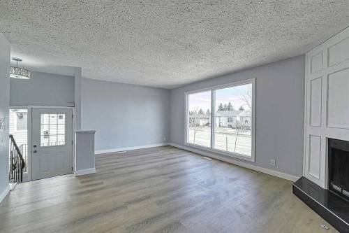 71 Falton Drive Ne, Calgary, AB - Indoor With Fireplace