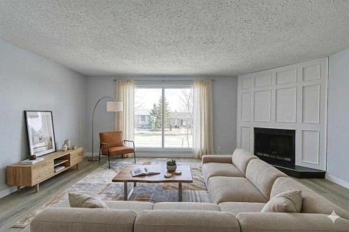 71 Falton Drive Ne, Calgary, AB - Indoor Photo Showing Living Room With Fireplace