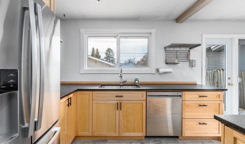 5207 5 Avenue Se, Calgary, AB - Indoor Photo Showing Kitchen With Stainless Steel Kitchen With Double Sink