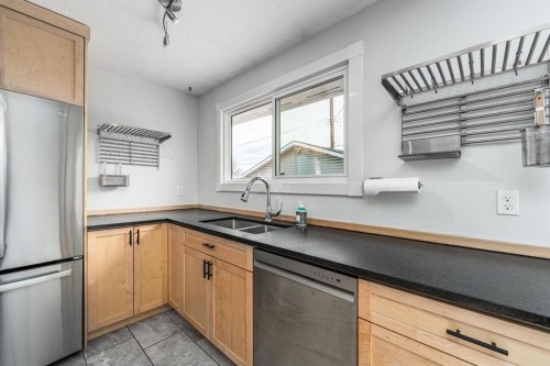 5207 5 Avenue Se, Calgary, AB - Indoor Photo Showing Kitchen With Double Sink