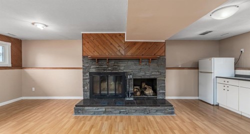 5207 5 Avenue Se, Calgary, AB - Indoor Photo Showing Living Room With Fireplace