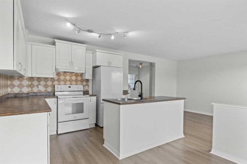 289 Hidden Spring Green Nw, Calgary, AB - Indoor Photo Showing Kitchen