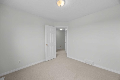 289 Hidden Spring Green Nw, Calgary, AB - Indoor Photo Showing Other Room