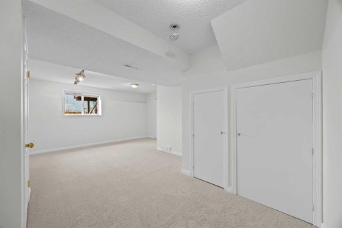 289 Hidden Spring Green Nw, Calgary, AB - Indoor Photo Showing Other Room