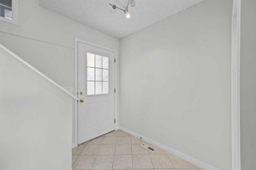 289 Hidden Spring Green Nw, Calgary, AB - Indoor Photo Showing Other Room
