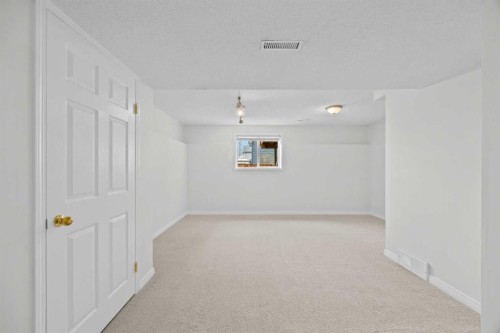 289 Hidden Spring Green Nw, Calgary, AB - Indoor Photo Showing Other Room