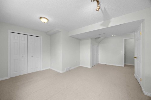 289 Hidden Spring Green Nw, Calgary, AB - Indoor Photo Showing Other Room