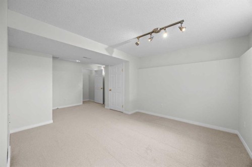 289 Hidden Spring Green Nw, Calgary, AB - Indoor Photo Showing Other Room