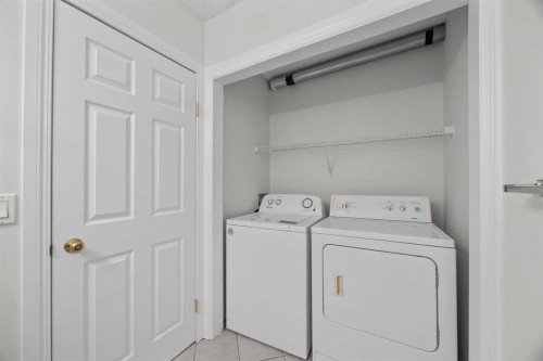 289 Hidden Spring Green Nw, Calgary, AB - Indoor Photo Showing Laundry Room