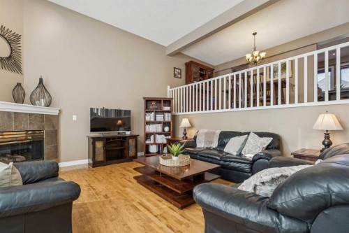 110 Candle Terrace Sw, Calgary, AB - Indoor Photo Showing Living Room With Fireplace