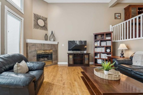 110 Candle Terrace Sw, Calgary, AB - Indoor Photo Showing Living Room With Fireplace