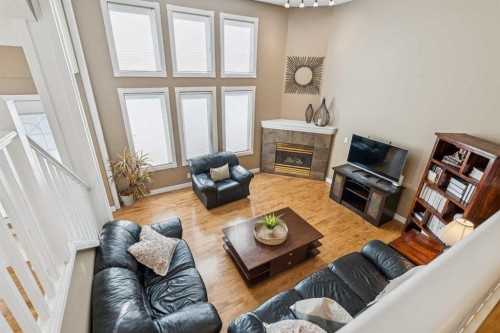 110 Candle Terrace Sw, Calgary, AB - Indoor Photo Showing Living Room With Fireplace