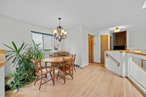 242 Hidden Spring Mews Nw, Calgary, AB - Indoor Photo Showing Dining Room
