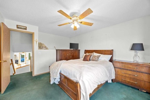 242 Hidden Spring Mews Nw, Calgary, AB - Indoor Photo Showing Bedroom