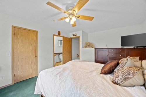 242 Hidden Spring Mews Nw, Calgary, AB - Indoor Photo Showing Bedroom