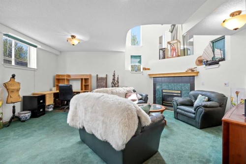 242 Hidden Spring Mews Nw, Calgary, AB - Indoor With Fireplace
