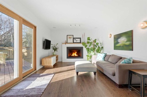 5893 Dalcastle Drive Nw, Calgary, AB - Indoor Photo Showing Living Room With Fireplace