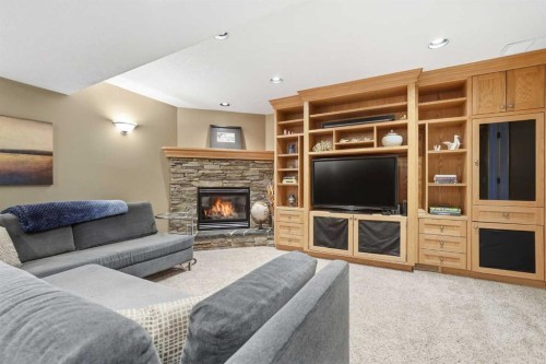 5893 Dalcastle Drive Nw, Calgary, AB - Indoor Photo Showing Living Room With Fireplace