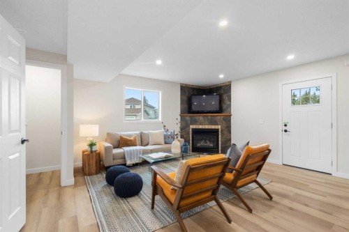 49 Martin Crossing Green Ne, Calgary, AB - Indoor Photo Showing Living Room With Fireplace