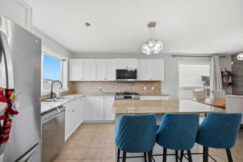 39 Panora Square Nw, Calgary, AB - Indoor Photo Showing Kitchen With Double Sink