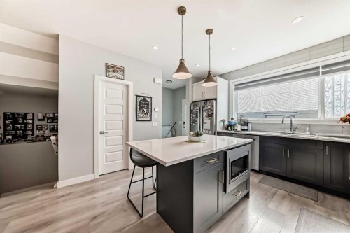 15053 37 Street Sw, Calgary, AB - Indoor Photo Showing Kitchen With Double Sink With Upgraded Kitchen