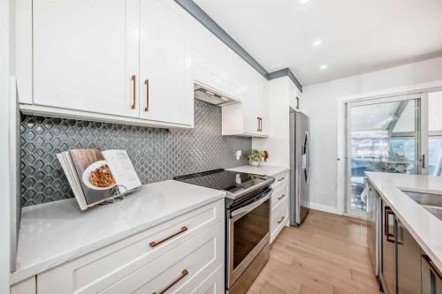 9215 Allison Drive Se, Calgary, AB - Indoor Photo Showing Kitchen With Stainless Steel Kitchen With Upgraded Kitchen
