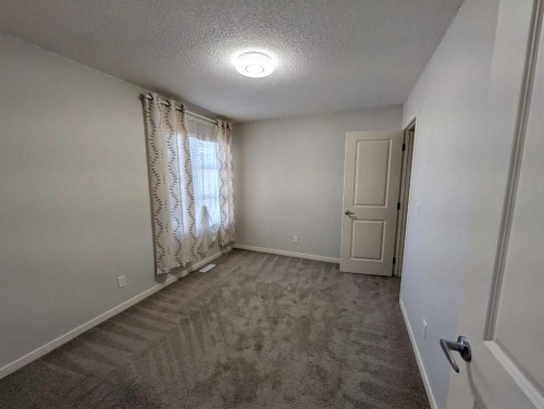 54 Seton Manor Se, Calgary, AB - Indoor Photo Showing Other Room