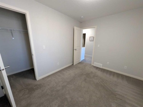 54 Seton Manor Se, Calgary, AB - Indoor Photo Showing Other Room