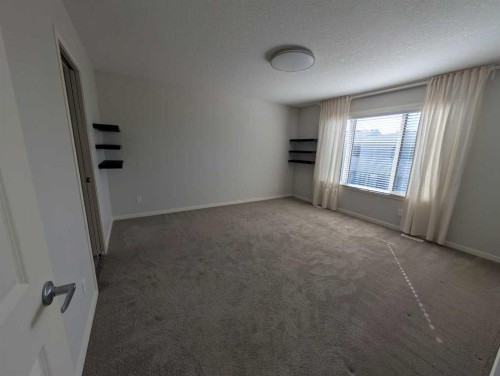 54 Seton Manor Se, Calgary, AB - Indoor Photo Showing Other Room