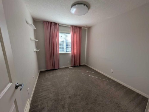 54 Seton Manor Se, Calgary, AB - Indoor Photo Showing Other Room