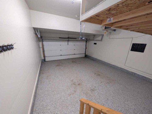 54 Seton Manor Se, Calgary, AB - Indoor Photo Showing Garage
