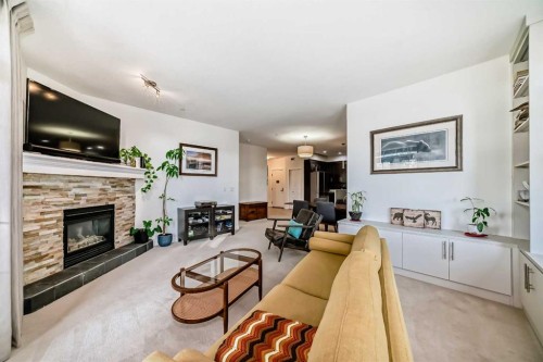 116-1005A Westmount Drive, Strathmore, AB - Indoor Photo Showing Living Room With Fireplace