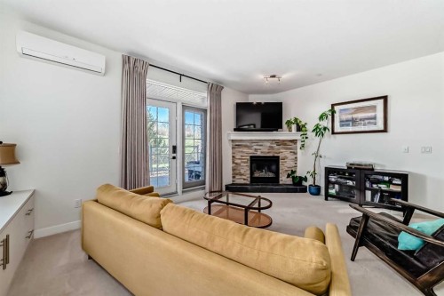116-1005A Westmount Drive, Strathmore, AB - Indoor Photo Showing Living Room With Fireplace