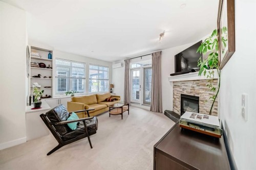 116-1005A Westmount Drive, Strathmore, AB - Indoor Photo Showing Living Room With Fireplace