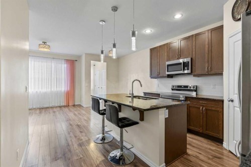 1545 Legacy Circle Se, Calgary, AB - Indoor Photo Showing Kitchen With Double Sink With Upgraded Kitchen