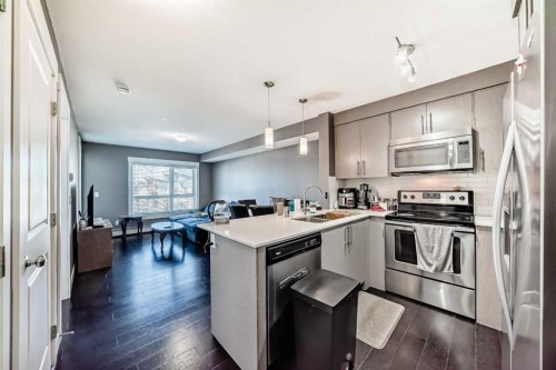 6409-302 Skyview Ranch Drive Ne, Calgary, AB - Indoor Photo Showing Kitchen With Stainless Steel Kitchen With Double Sink With Upgraded Kitchen
