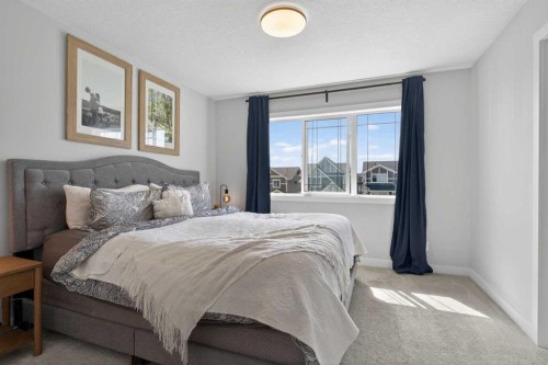 394 Sundown Road, Cochrane, AB - Indoor Photo Showing Bedroom