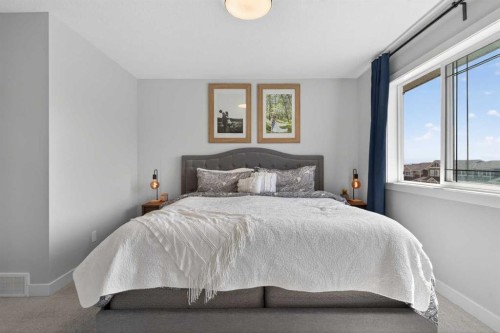 394 Sundown Road, Cochrane, AB - Indoor Photo Showing Bedroom