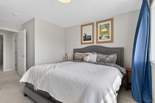 394 Sundown Road, Cochrane, AB - Indoor Photo Showing Bedroom