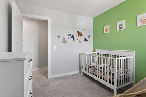 394 Sundown Road, Cochrane, AB - Indoor Photo Showing Bedroom