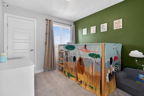 394 Sundown Road, Cochrane, AB - Indoor Photo Showing Bedroom