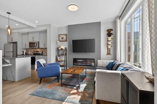 394 Sundown Road, Cochrane, AB - Indoor With Fireplace