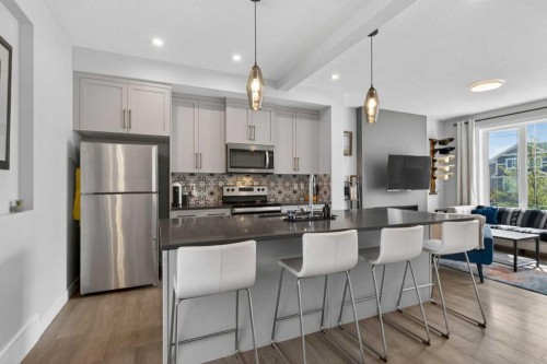 394 Sundown Road, Cochrane, AB - Indoor Photo Showing Kitchen With Upgraded Kitchen