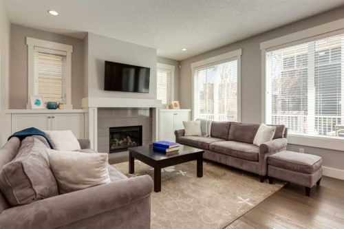 76 Dieppe Drive Sw, Calgary, AB - Indoor Photo Showing Living Room With Fireplace