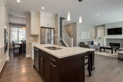 76 Dieppe Drive Sw, Calgary, AB - Indoor Photo Showing Kitchen With Fireplace With Double Sink With Upgraded Kitchen