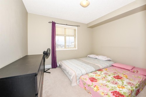 302-5 Saddlestone Way Ne, Calgary, AB - Indoor Photo Showing Bedroom