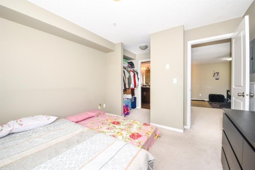 302-5 Saddlestone Way Ne, Calgary, AB - Indoor Photo Showing Bedroom