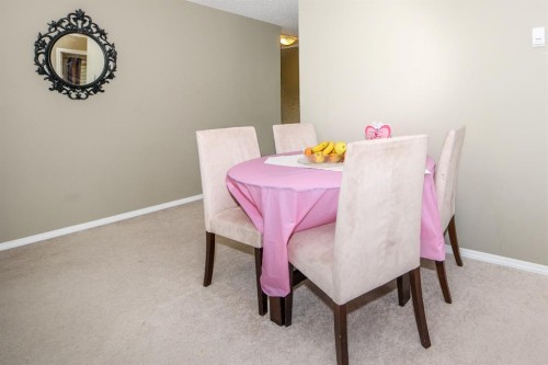 302-5 Saddlestone Way Ne, Calgary, AB - Indoor Photo Showing Dining Room