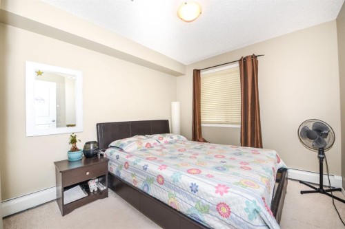 302-5 Saddlestone Way Ne, Calgary, AB - Indoor Photo Showing Bedroom
